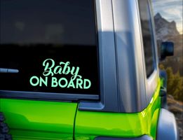 Cute baby on board {decal} car sticker with playful lettering for vehicle safety awareness.