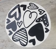 Black Hearts {decal} car sticker with playful lettering for vehicle safety awareness.