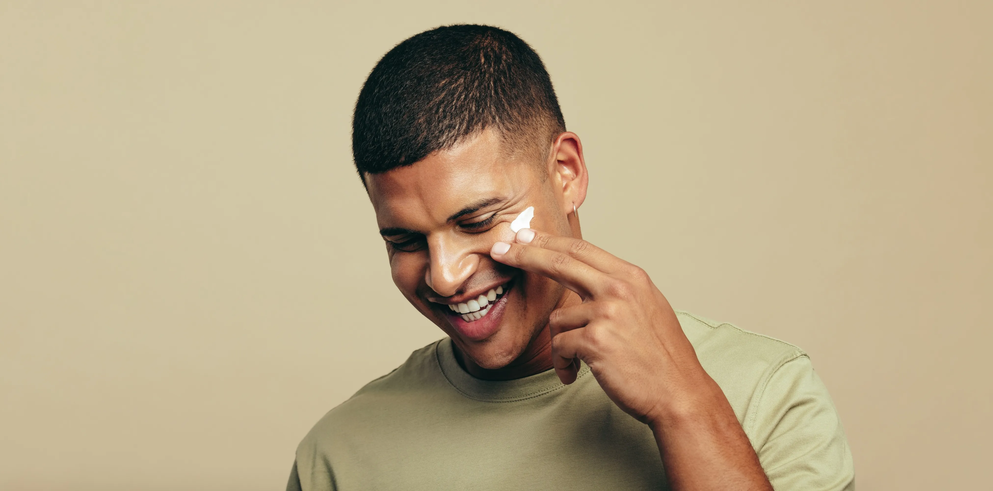 Elegant cologne bottles arranged with natural ingredients that highlight their scent notes. No human shapes.