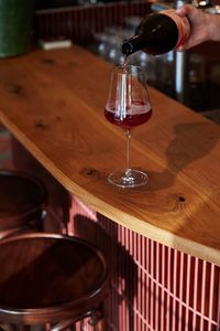 Glass of Red Wine on timber bar