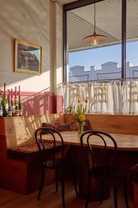 Window seating with chairs and florals