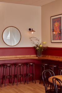 Back bar area, with mirror on wall and flowers