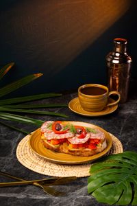 New Orleans toast with Italian salami, pickled and roasted paprika, gherkins, and black olives on artisan bread served as a savory all-day brunch at Lašė Lašė specialty coffee café in Ari, Bangkok.
