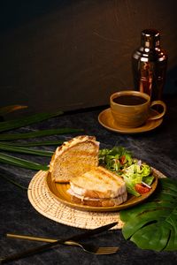 Ari ham and cheese toast with Paris ham, Norwegian cheese, artisan bread, and fresh side salad served as an all-day brunch at Lašė Lašė specialty coffee café in Ari, Bangkok.