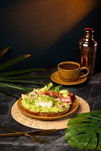 Ari avocado toast with fresh avocado, artisan bread, radish, cherry tomatoes, balsamic dressing, and side salad served as an all-day brunch and breakfast at Lašė Lašė specialty café near BTS Ari, Bangkok.