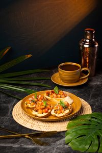 Classic Ari bruschetta with toasted French baguette, fresh tomatoes, basil, and olive oil served as a light all-day brunch at Lašė Lašė specialty coffee café in Ari, Bangkok.